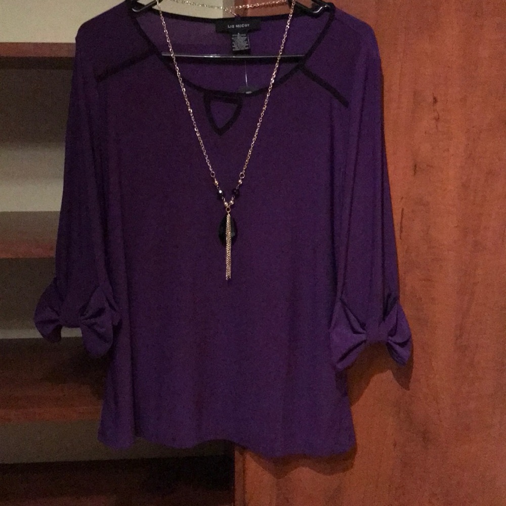 Stunning purple blouse with necklace and beautiful bow detail on cuffs